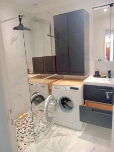 a bathroom with two washing machines and a sink at Maison Lauret in Agde +64 photos