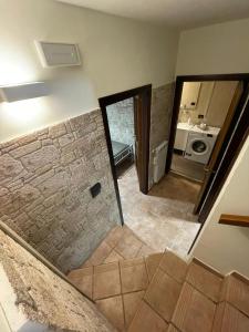a view of a bathroom with a stone wall at Il Rifugio nel Matese in San Massimo +8 photos