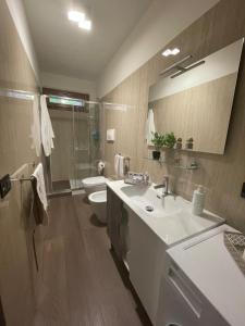 a bathroom with a white sink and a toilet at Il Rifugio nel Matese in San Massimo