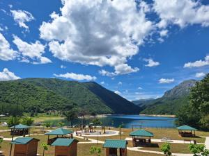 a view of a lake with mountains in the background at DSM & Victory in Plužine