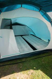 a tent that is sitting in the grass at Munich Oktoberfest Central Camping Village in Munich