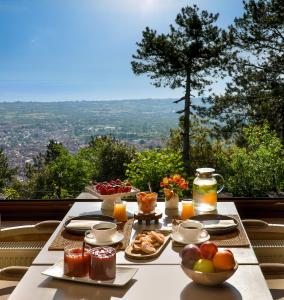 a table with food on it with a view at Ktima Faki, The One & Only Destination on Mount Olympus in Litochoro