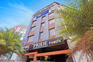 a building with a sign that reads pride foods at FabHotel Pride - Electronic City in Bangalore