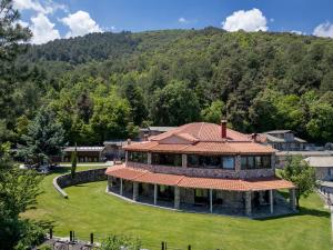 an aerial view of a house with a roof at Ktima Faki, The One & Only Destination on Mount Olympus in Litochoro