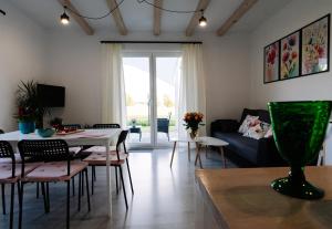 a living room with a table and a couch at 4 Pory Roku in Darłowo