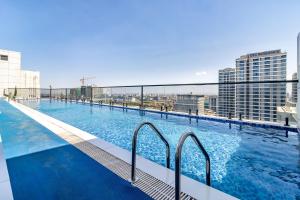 a large swimming pool on top of a building at Luxury 1 bedroom in Westlands, Rooftop Pool, Next to Kempinski & GTC, Fast Wifi & Pool Table in Nairobi