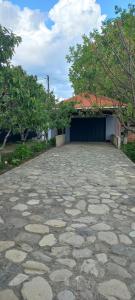 a large stone parking lot with a garage at Mountain Hearth in Vǝndam
