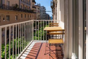 a table and chairs sitting on a balcony at Salerno Stay in Salerno