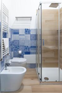 a bathroom with a toilet and a sink and a shower at Salerno Stay in Salerno +37 photos