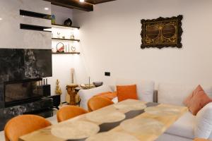 a living room with a table and a couch at Liso Prostir in Lisopotik
