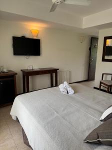a bedroom with a bed with two towels on it at Villa Ostende Apart Hotel & Spa in Ostende