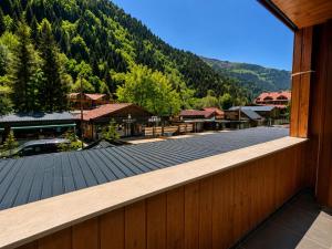 a view from the balcony of a resort with a mountain at Kuloğlu Otel ve Restoran in Uzungöl