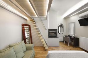a living room with a staircase and a couch at Ktima Faki, The One & Only Destination on Mount Olympus in Litochoro