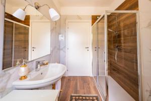 a bathroom with a sink and a shower at GuestHost - Barni House in Montesilvano +37 photos