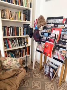 a living room with a book shelf filled with books at Casa-Museo centro de Caguas in Caguas