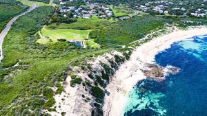 an aerial view of a beach and the ocean at Sola Studios in Margaret River Town