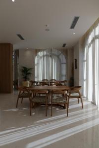a dining room with a wooden table and chairs at CITADEL Heritage Hotel Berat in Berat
