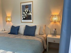 a living room with a bed and two lamps at Fish & Banana Beach House in Taurito +54 photos