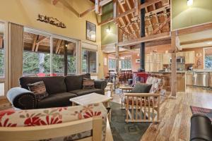 a living room with a couch and a table at A-Frame Home with Deck & BBQ - VH223 cabin in Bear Valley