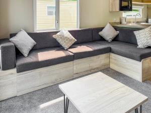 a couch with pillows on it in a living room at Forest Sherman - Uk50089 in Durham