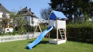a playground with a slide in a yard at Ferienwohnung Daun in Daun