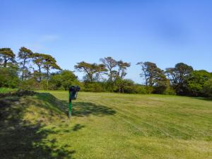 a parking meter in the middle of a field at The Garden Lodge Flat - Uk49415 in Pembrokeshire