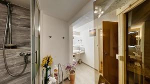 a bathroom with a shower and a sink at Ferienwohnung Vulkaneifel in Daun +6 photos
