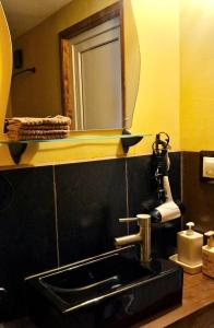 a bathroom with a sink and a mirror at Pirts Rozēni in Saulkrasti +22 photos