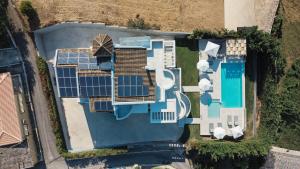 an overhead view of a house with solar panels on it at Casa Grande Private Luxury Villa in Alykes Potamou