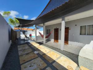 a house with a playground in the backyard at Descanso das Águas in Santo Amaro