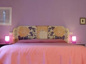 Posteľ alebo postele v izbe v ubytovaní Elisir b&b