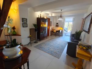 a living room with a couch and a table at Villa Cristina in Casteldaccia