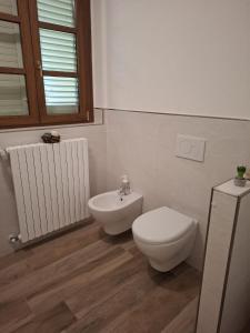 a bathroom with a toilet and a bidet at Oasi della Calvana in Vaiano