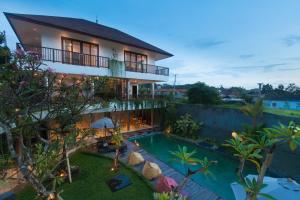 an image of a house with a swimming pool at Athaya Ubud in Ubud