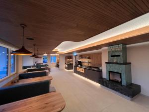 a living room with a couch and a fireplace at Landhaus Lührmann in Ramsau am Dachstein