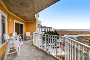 a balcony of a house with a view of the ocean at Playa Flamingo #302 in Ocean City