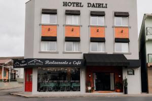 a building with a hotel dakhtar at Hotel Daieli in Otacílio Costa