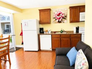 a kitchen with a white refrigerator and a sink at Escarpment Heights Motel in Tobermory