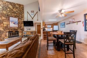 a living room with a couch and a table at Snowdance Manor #405 : 2 in Keystone