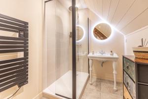 a bathroom with a shower and a sink at Le Moulin de mes garçons in Alby +29 photos