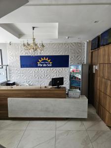 a fast food restaurant with a sign on the wall at Palace Hotel Pôr do Sol in Vitória da Conquista