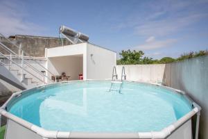 a hot tub on the roof of a house at Casa "O Chafariz" in Amoreira