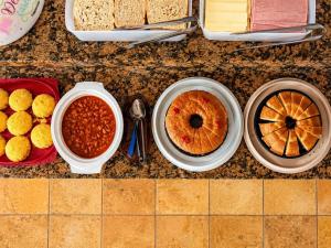 a bunch of different types of food on a counter at Pousada Wilclé Center Preá in Prea +18 photos