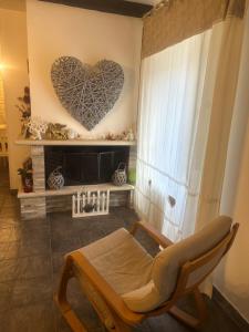 a room with a bed and a heart on the wall at Aer in Caserta