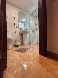 a bathroom with a shower and a sink and a toilet at MK VALeNCIA in Valencia