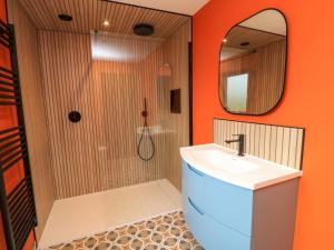 a bathroom with a shower and a sink and a mirror at The Cozie Sow in Yeovil +14 photos