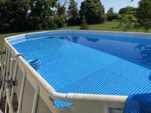 a large swimming pool on a deck at Gite de Saint Jean in Saint-Jean-de-Thouars