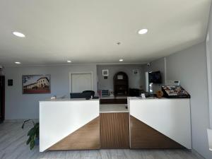 an office with a white counter top in a room at Mission Inn San Luis Obispo in San Luis Obispo