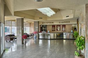 a lobby with a reception desk in a building at Yala Rama Hotel in Sathani Yala