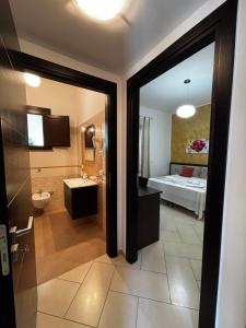 a bathroom with a sink and a bed in a room at B&B La Chiocciola in Castelluzzo +76 photos